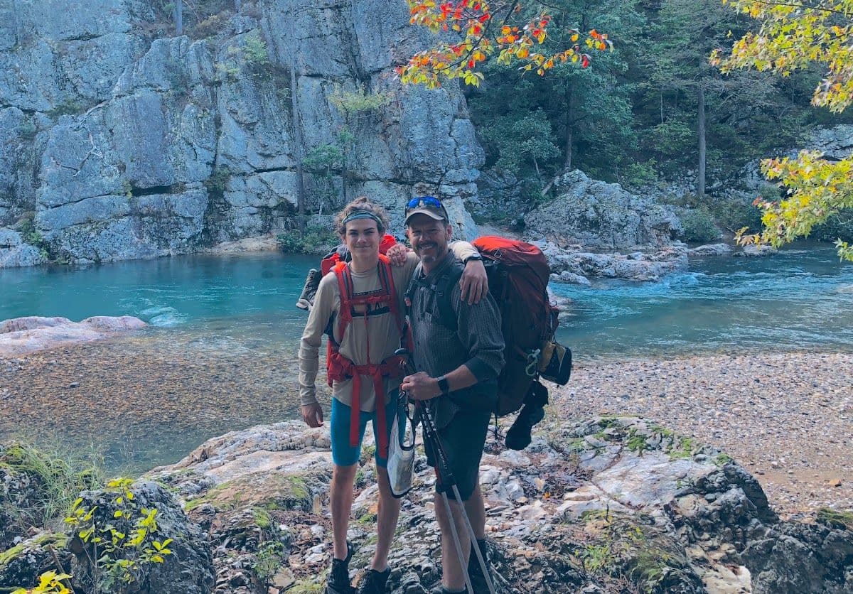 Backpacking crew beside a clear Ozark river